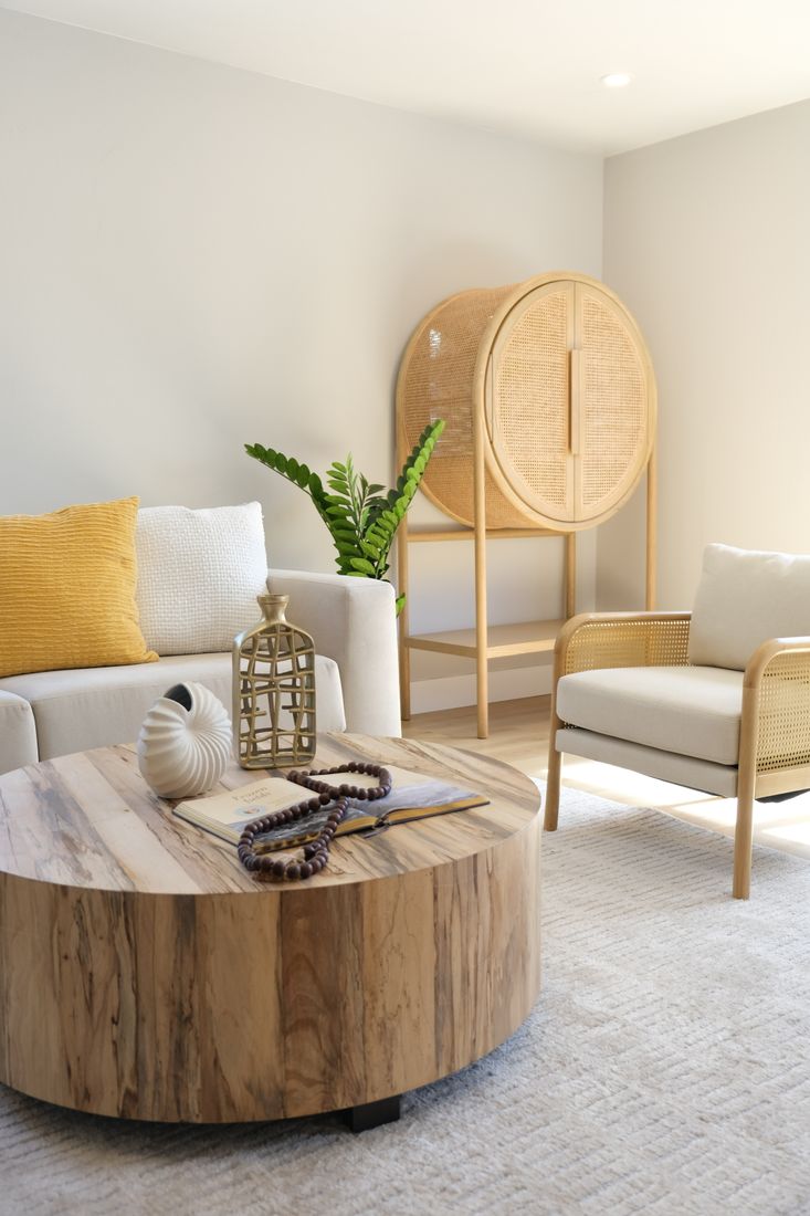 Bright living room with natural wood furniture featured in the Sunday Home Care cleaning demo